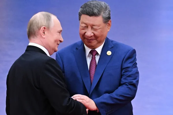 Vladimir Putin and Xi Jinping greet each other in Tianjin, China