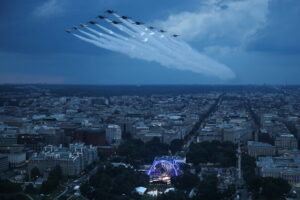 TOPSHOT - US Air Force Thunderbirds and the US Navy Blue Angels perform a flyover during the National Anthem at UFC Freedom 250 on the South Lawn of the White House, in Washington, DC, on June 14, 2026. (Photo by Win McNamee / POOL / AFP via Getty Images)