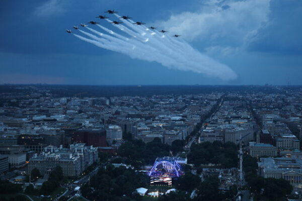 TOPSHOT - US Air Force Thunderbirds and the US Navy Blue Angels perform a flyover during the National Anthem at UFC Freedom 250 on the South Lawn of the White House, in Washington, DC, on June 14, 2026. (Photo by Win McNamee / POOL / AFP via Getty Images)