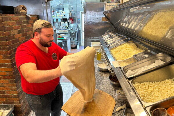 Salvatore Lo Duca makes pizza at Lo Duca Pizza Tuesday, May 12, 2026, in the Brooklyn borough of New York. (AP Photo/David R. Martin)