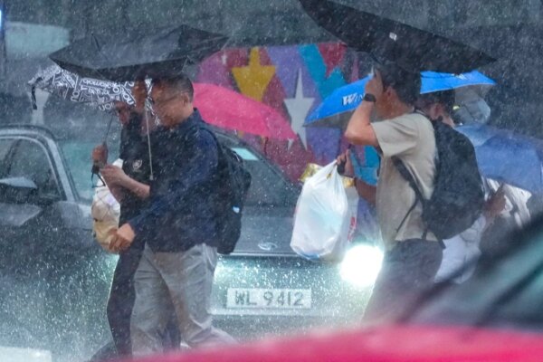 Red rainstorm warning lowered to amber but unsettled weather to persist