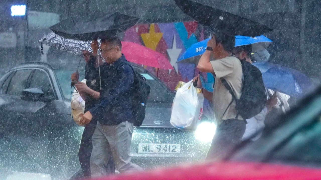 Red rainstorm warning lowered to amber but unsettled weather to persist