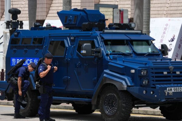 Hong Kong police search 15 in former July 1 protest areas, man taken away