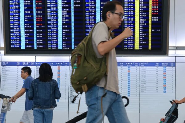 Some air passengers remain stranded at Hong Kong airport after Typhoon Noul