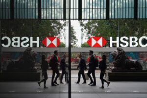 Pedestrians walk past HSBC’s head office in Central. Photo: Elson Li