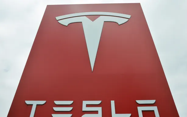 ALHAMBRA, CALIFORNIA - JULY 02: The Tesla logo is displayed at a Tesla dealership on July 2, 2026 in Alhambra, California. Tesla stock closed the trading day down 7.5 percent despite a strong quarterly deliveries report from the electric vehicle (EV) maker.   Mario Tama/Getty Images/AFP (Photo by MARIO TAMA / GETTY IMAGES NORTH AMERICA / Getty Images via AFP)