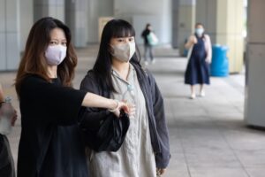 Park Hoi-lam (right) leaves the High Court on Tuesday. She has accused cabby Henry Cheng of negligence. Photo: Brian Wong