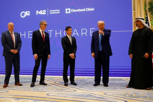 US President Donald Trump speaks next to Crown Prince of Abu Dhabi Sheikh Khaled bin Mohamed bin Zayed Al Nahyan, CEO of Cleveland Clinic Tom Mihaljevic and CEO of G42 Peng Xiao as he attends a business forum at Qasr Al Watan during the final stop of his Gulf visit, in Abu Dhabi, UAE.