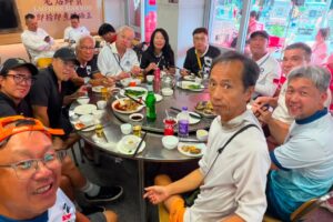 Thomas Wong (rear, black shirt) and his friends enjoy a seafood feast on Guishan Island. Photo: Handout