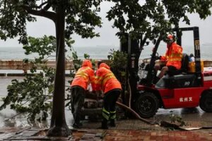 Workers clear fallen debris and obstacles from the road after Typhoon Noul, in Hong Kong, China, July 26, 2026. (REUTERS)