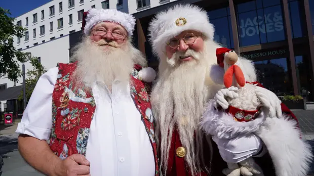 Robert Hercz, a 64-year-old Santa Claus performer with another Santa performer.