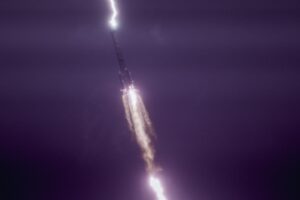 lightning strikes a rocket in the sky