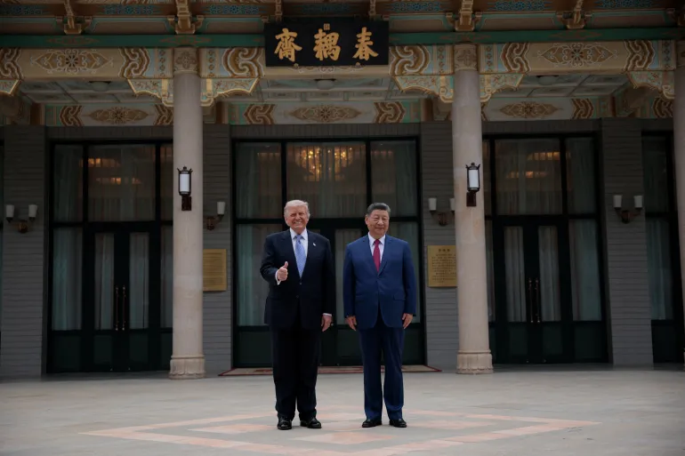 US President Donald Trump poses for a picture with Chinese President Xi Jinping during a visit to the Zhongnanhai garden in Beijing, China, on May 15, 2026