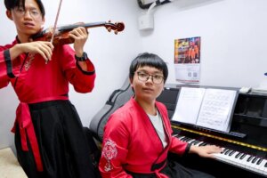 This 13-year-old learned to play piano in a subdivided flat. Now he’s going on stage