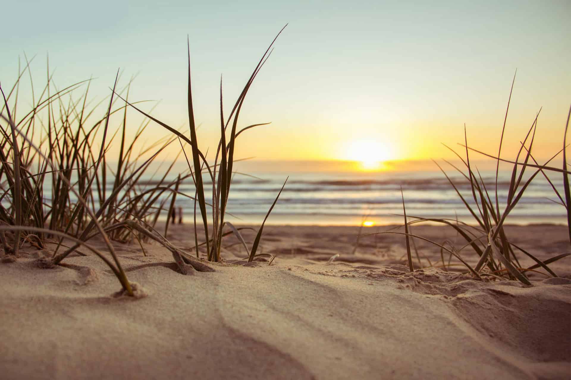 sand on a beach at sunset