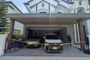 Impounded luxury vehicles believed purchased with illegal money from conned forex investment victims, at a raided house on June 16. (Photo: DSI)