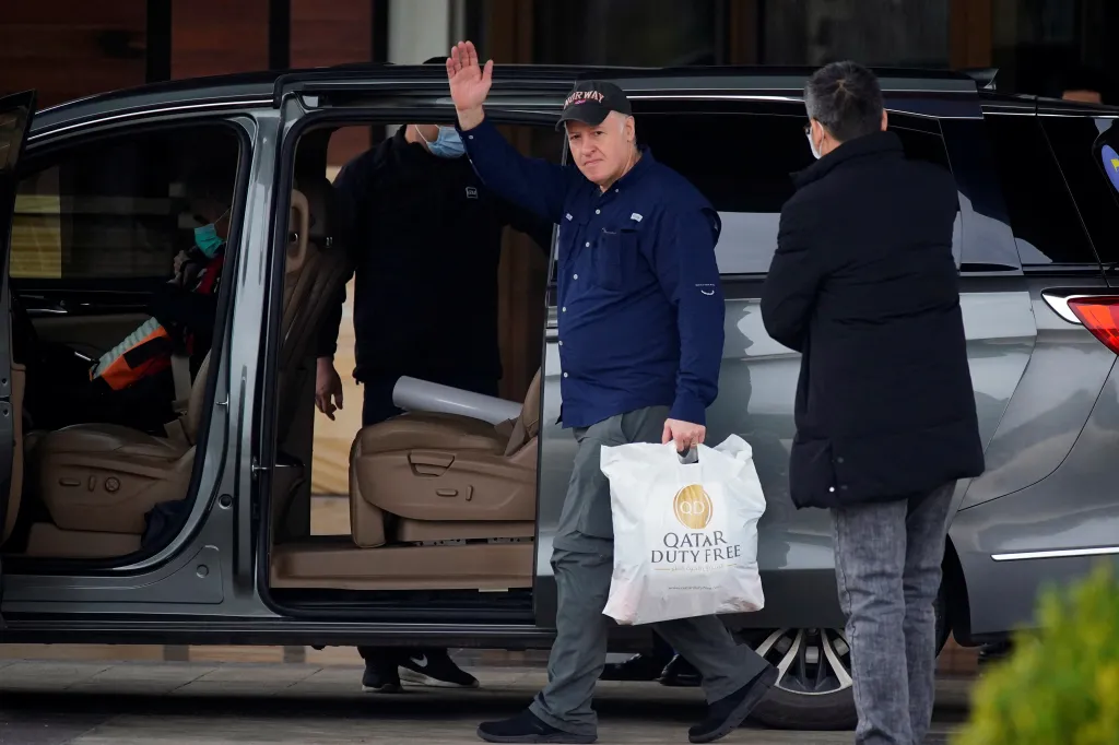 Peter Daszak waving as he leaves a hotel in Wuhan, Hubei province, China.