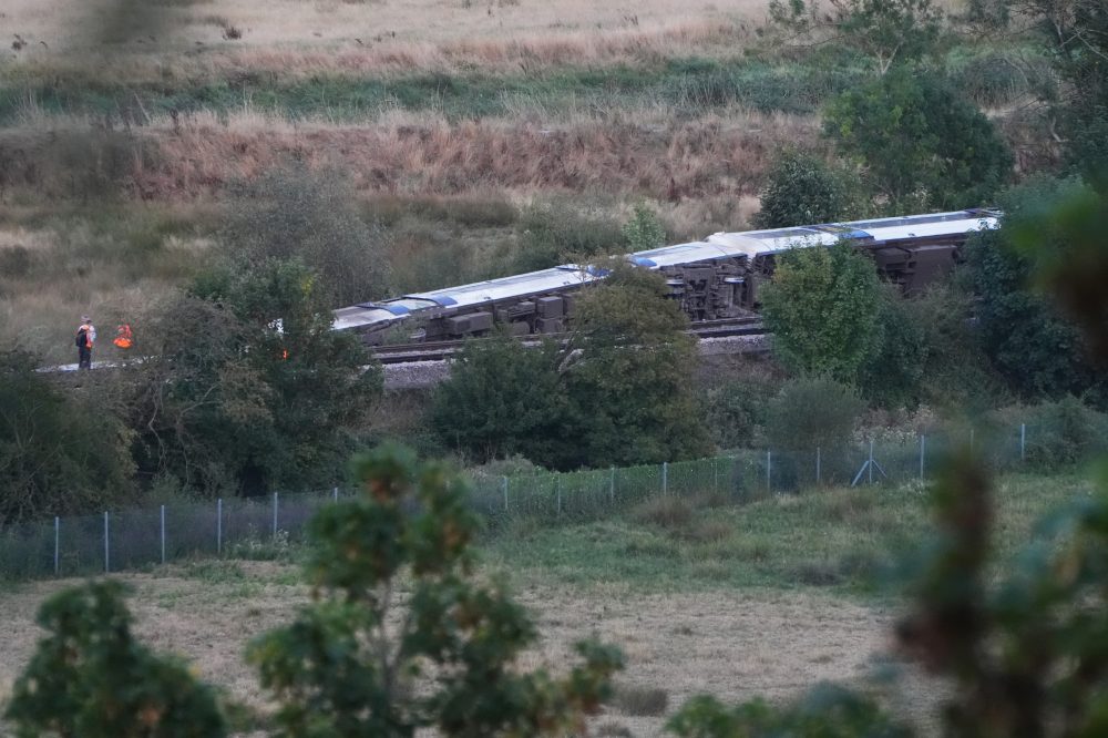 Passenger train derails and 11 people injured after carriages overturn in southern England