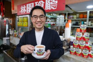 Jayden Looi enjoys a cup of milk tea at Lam Yuen Restaurant in Diamond Hill. Photo: Dickson Lee