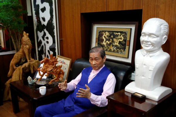 Chang An-lo, known as "White wolf", leader of the Chinese Unification Promotion Party (CUPP), sits next to a bust of China's late leader Deng Xiaoping during an interview in Taipei, Taiwan May 2, 2019. Picture taken May 2, 2019. REUTERS/Tyrone Siu