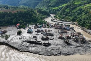 A drone view shows mud covering buildings and property following devastating floods at Trishuli in Nuwakot district, Nepal, on August 27, 2026. [Navesh Chitrakar/Reuters]