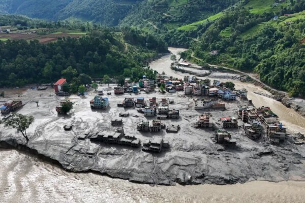 A drone view shows mud covering buildings and property following devastating floods at Trishuli in Nuwakot district, Nepal, on August 27, 2026. [Navesh Chitrakar/Reuters]