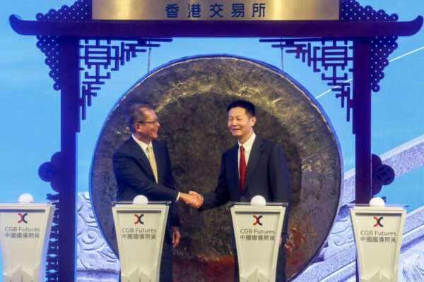 Hong Kong Financial Secretary Paul Chan Mo-po and China Securities Regulatory Commission Wu Qing at the Hong Kong exchange’s launch of China government bond futures on August 3. Photo: Jonathan Wong