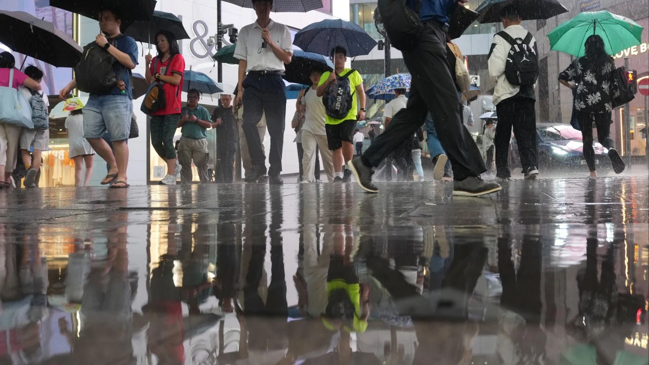 Relief after 9 blistering days as Hong Kong issues amber rainstorm warning