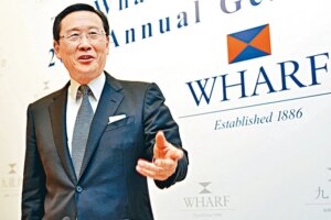 Peter Woo, Chairman of The Wharf (Holdings) Limited and Wheelock and Company Limited, speaks at a press conference in Hong Kong, China, June 6, 2013. Photo by Imaginechina via AFP
