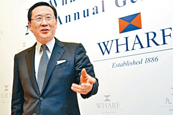 Peter Woo, Chairman of The Wharf (Holdings) Limited and Wheelock and Company Limited, speaks at a press conference in Hong Kong, China, June 6, 2013. Photo by Imaginechina via AFP