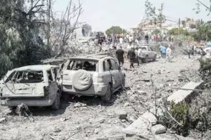 First aid responders and residents rush to the site of an Israeli airstrike that targeted the neighbourhood in the southern Lebanese village of Deir al-Zahrani on August 15 2026. (AFP)