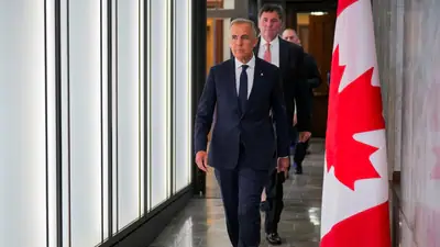 Canada’s Prime Minister Mark Carney walks to speak with the news media after he suspended trade negotiations with the United States, in Ottawa, Ontario, Canada August 22, 2026.  REUTERS/Chris Tanouye (REUTERS)