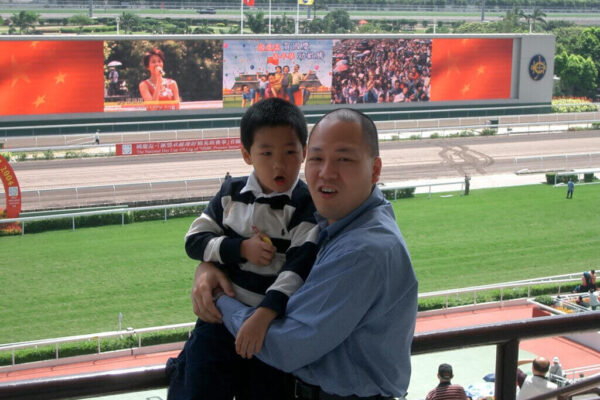 A younf Alex So with father Chris at National Day Cup meeting at Sha Tin