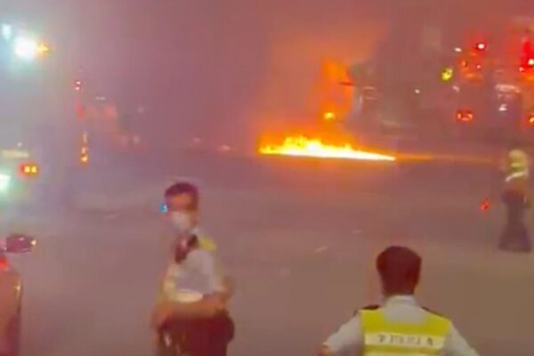 Truck driver flees after vehicle crashes and bursts into flames on Lantau highway
