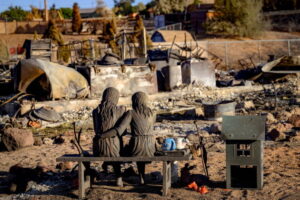 TOPSHOT - A statue is left amid the remains of a home burned by the Hawk Fire in Reno, Nevada on August 24, 2026. Tens of thousands of people looked set to spend another night away from home on August 24 as a wind-driven fire bore down on the western US city of Reno. Schools were shuttered as smoke swathed the city in Nevada, near the California border, home to around 280,000 people.
Around 24,000 were still under evacuation orders on Monday, officials said, down from over 40,000 at its peak. (Photo by Josh Edelson / AFP via Getty Images)