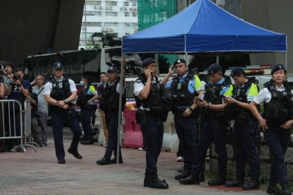 Hong Kong woman arrested for allegedly wearing seditious T-shirt outside court