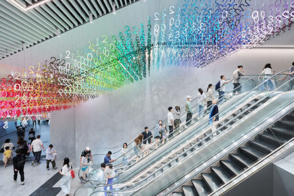Colorful numerals hang in overlapping rows as part of Emmanuelle Moureaux's FLOW installation.