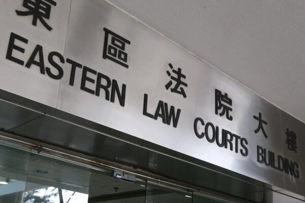 Hong Kong woman acquitted of protest-related charges after return from Australia