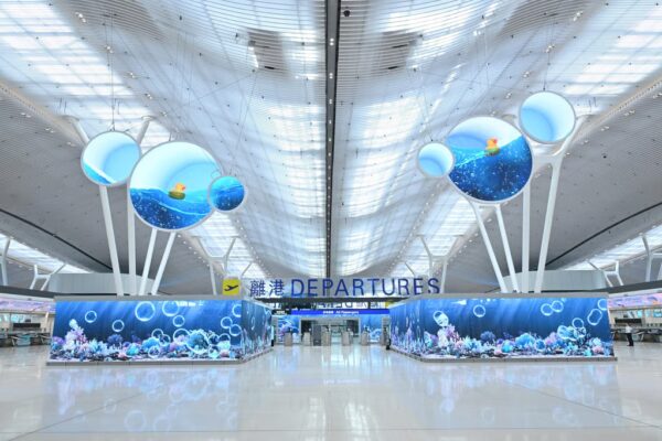 The departure hall at Hong Kong International Airport’s newly revamped Terminal 2 features large LED screens with ocean-themed displays. Photo: Airport Authority Hong Kong