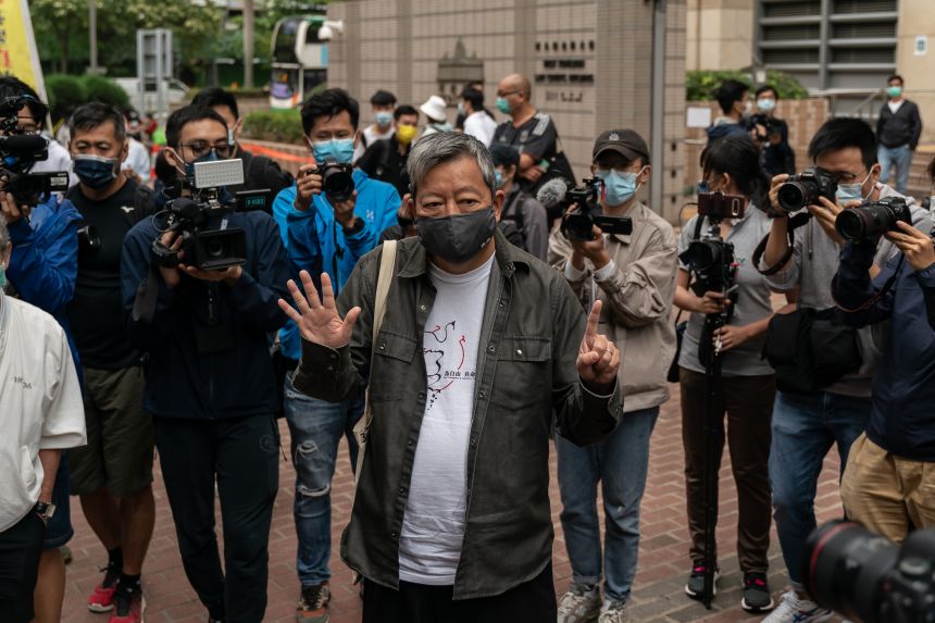 Pro-democracy activist and former lawmaker Lee Cheuk-yan makes gesture as he leaves West Kowloon court during a break of a sentencing hearing on April 16, 2021 in Hong Kong, China.
