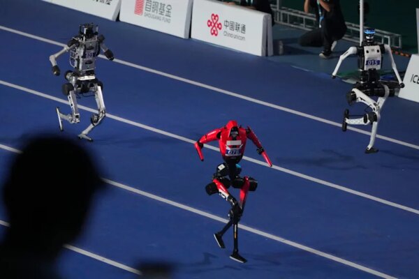 Robots compete in the 100m race during the opening ceremony of the World Humanoid Robot Games in Beijing, Saturday, Aug. 22, 2026. / Credit: Achmad Ibrahim
