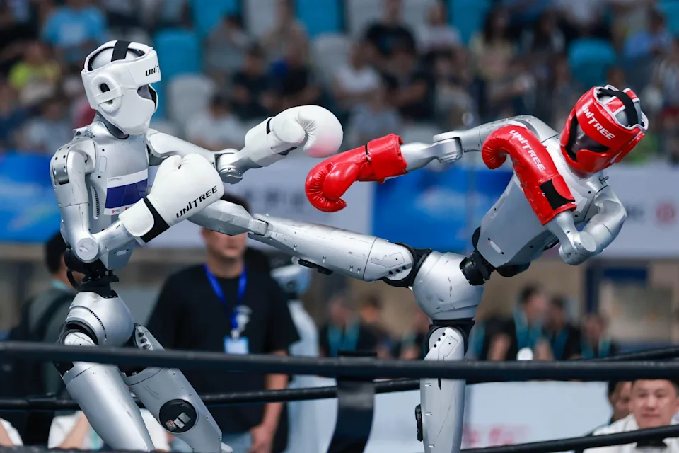 Humanoid robots compete in the kickboxing event on day 2 of the second World Humanoid Robot Games at the National Speed Skating Oval, Aug. 23, 2026, in Beijing, China. / Credit: Liu Xingchen/VCG/Getty