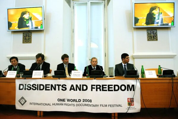 Michal Cizek/AFP via Getty Images, FILE - PHOTO: In this March 5, 2008, file photo, freedom activist Min Zin (far right) attends the Dissidents and Freedom forum at the Czech Foreign Ministry in Prague.