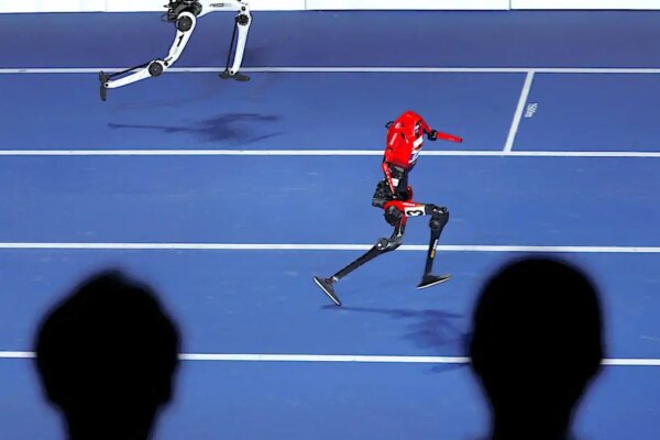 Lightning and Tiangong Ultra humanoid robots race 100 meters at the National Speed Skating Oval in Beijing.