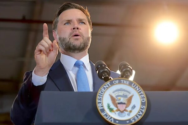 Vice President JD Vance speaks at a podium at CompoTech headquarters in Brewer, Maine.