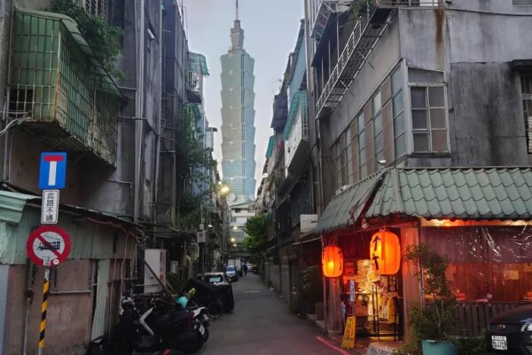 The iconic Taipei 101 skyscraper, the tallest building in Taiwan, can be seen between an alleyway in Taipei on December 26, 2022