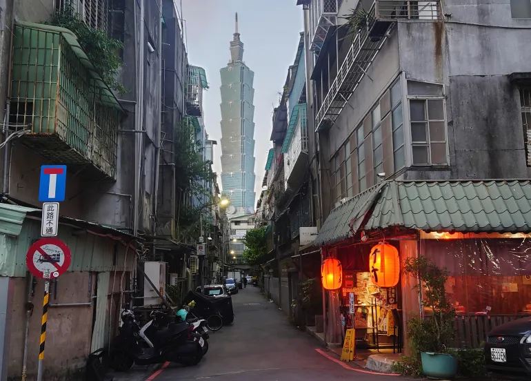 The iconic Taipei 101 skyscraper, the tallest building in Taiwan, can be seen between an alleyway in Taipei on December 26, 2022