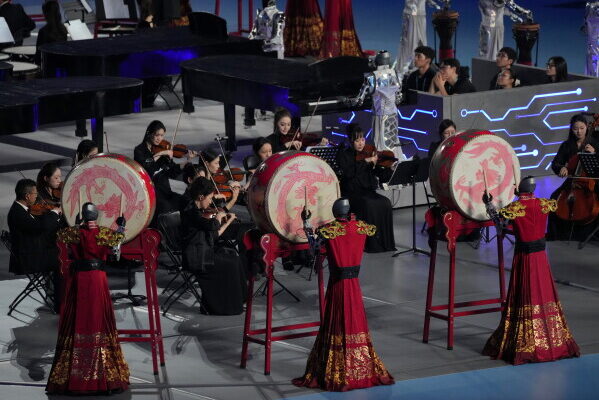Robots perform with drum during the opening ceremony of the World Humanoid Robot Games in Beijing, Saturday, Aug. 22, 2026. (AP Photo/Achmad Ibrahim)