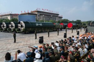 DF-5C nuclear-capable missiles on trucks parade through Beijing's Tiananmen Square.