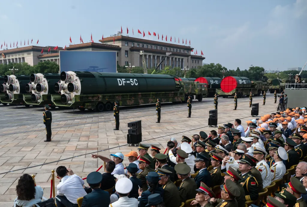 DF-5C nuclear-capable missiles on trucks parade through Beijing's Tiananmen Square.